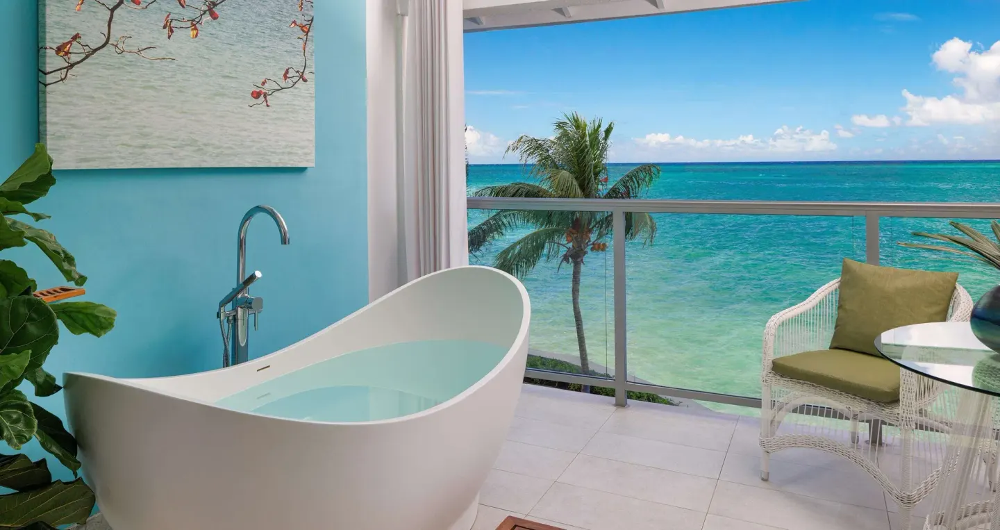 Club Penthouse balcony soaking tub with ocean view at Sandals Montego Bay.