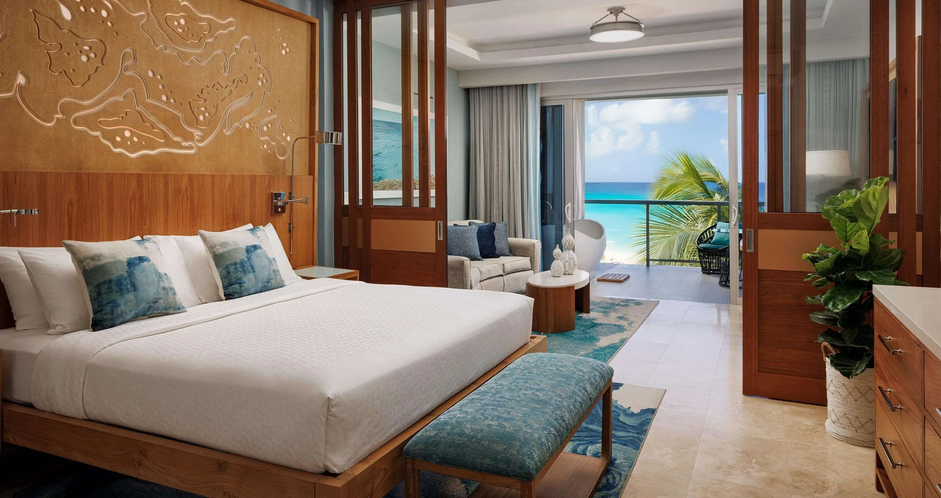 Luxury Suite 1 Bedroom Ocean View Beachfront Super Luxe with Balcony at Sandals Montego Bay with king bed, contemporary design, and private balcony overlooking the Caribbean.