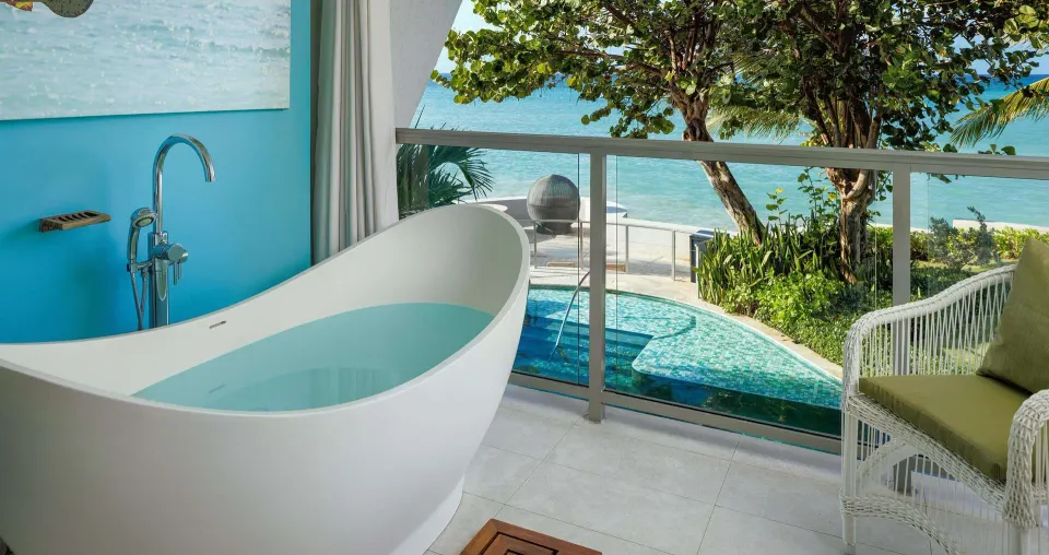 Balcony soaking tub with ocean view at Sandals Montego Bay