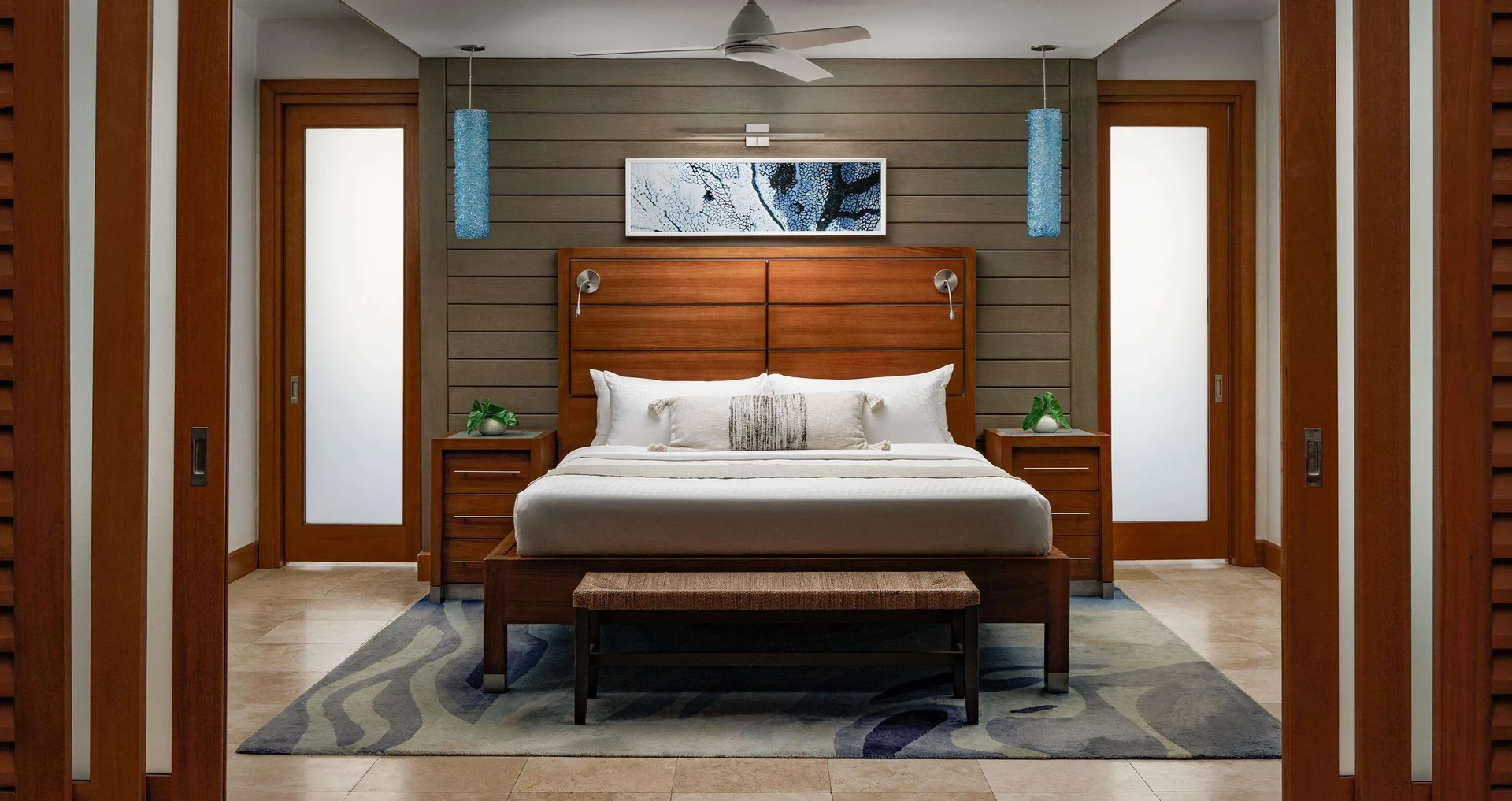 King bed in the beachfront Romeo Juliet villa bedroom at Sandals Montego Bay.