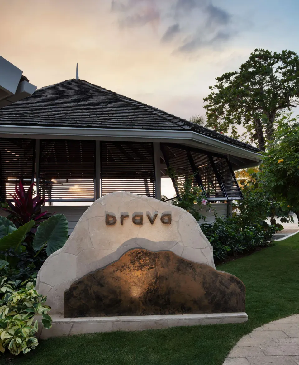 Brava restaurant sign outside a garden building at Sandals Negril.