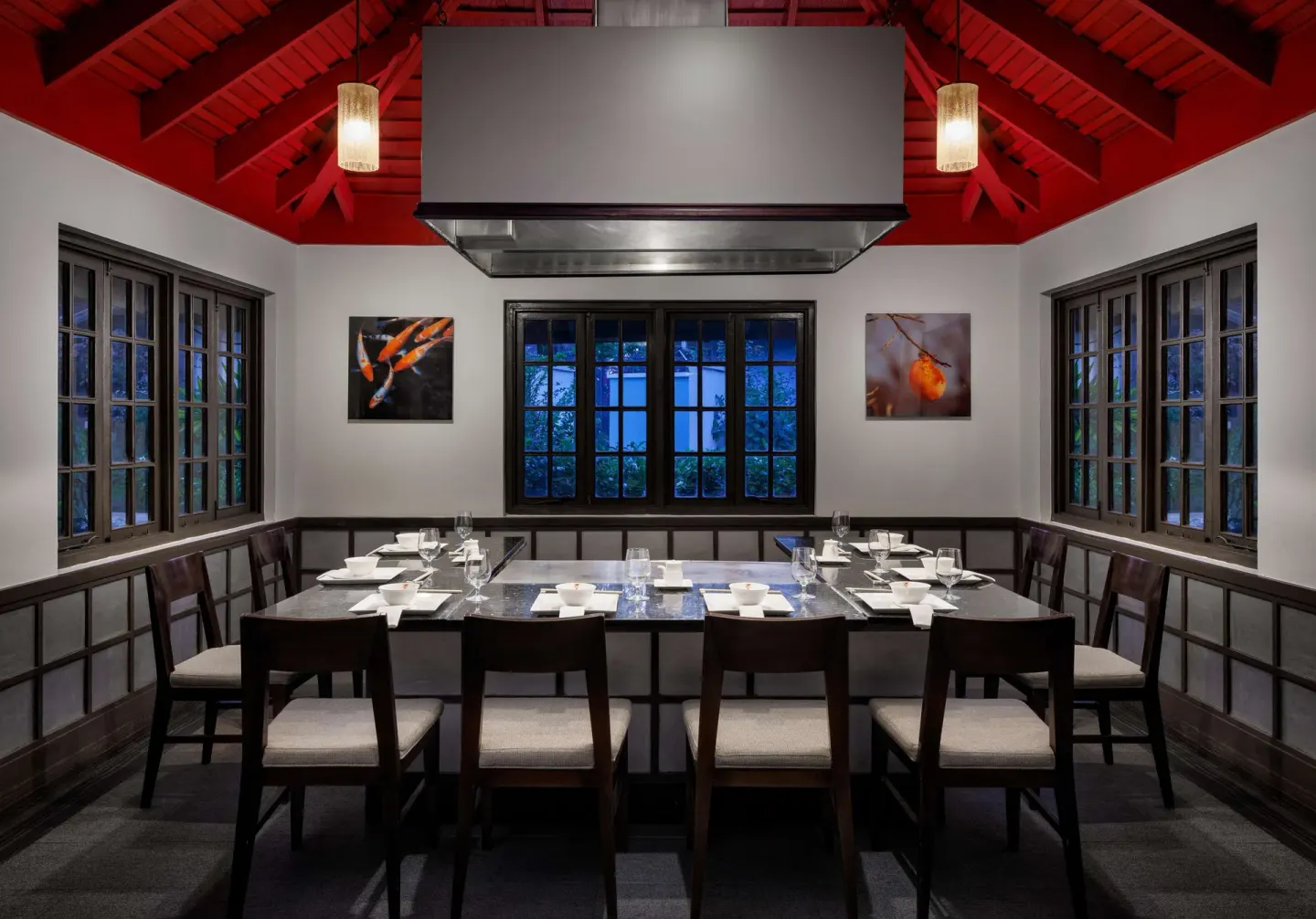 Communal teppanyaki table under a red vaulted ceiling at Sandals Negril.