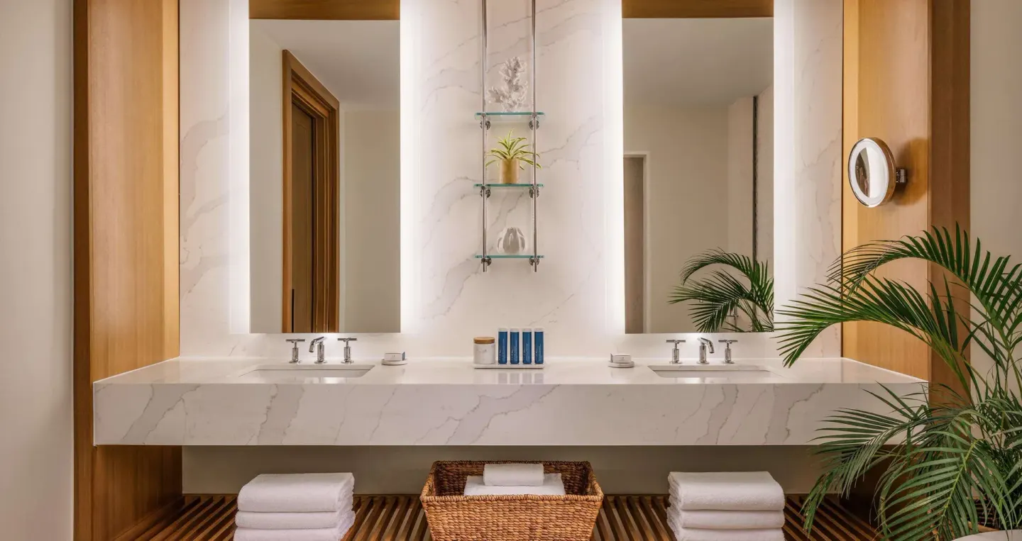 Double vanity bathroom in a Bamboo Grove Skypool suite at Sandals Negril.