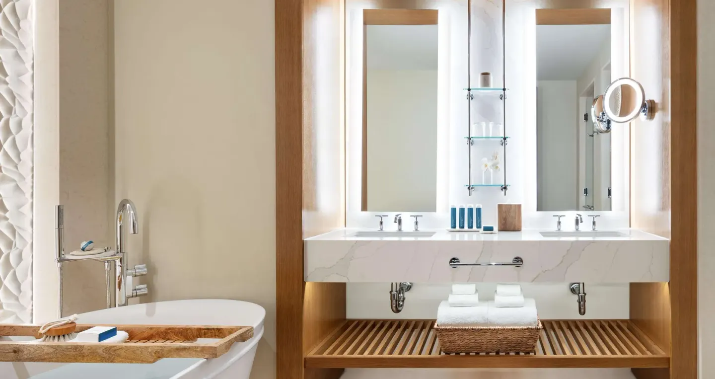 Bamboo Grove Swim-up Club Suite bathroom vanity and bathtub at Sandals Negril.