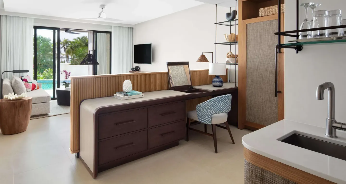 Bamboo Grove Swim-up Club Suite entry, kitchenette and lounge at Sandals Negril.