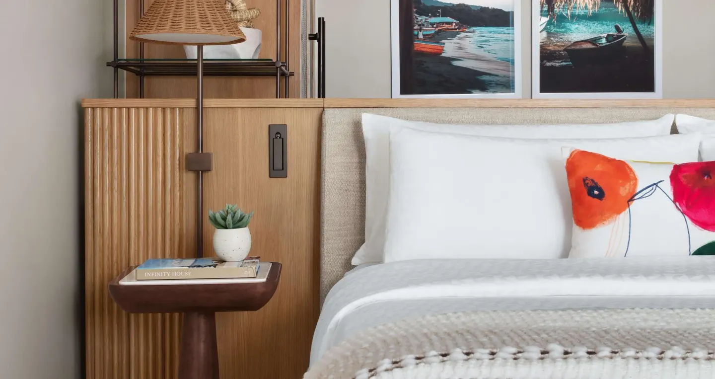 Close-up of the Bamboo Grove Swim-up Club Suite king bed at Sandals Negril.