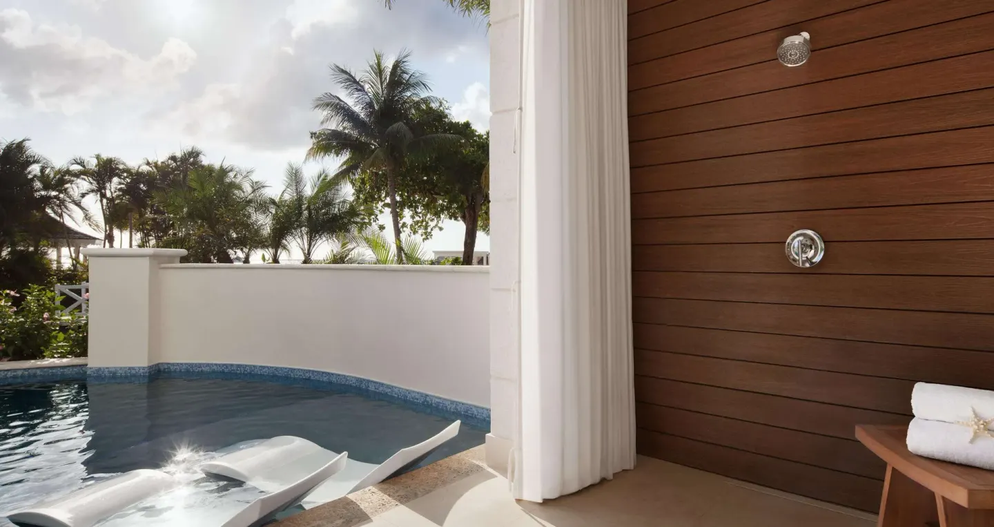 Bamboo Grove Swim-up Club Suite terrace shower and pool at Sandals Negril.