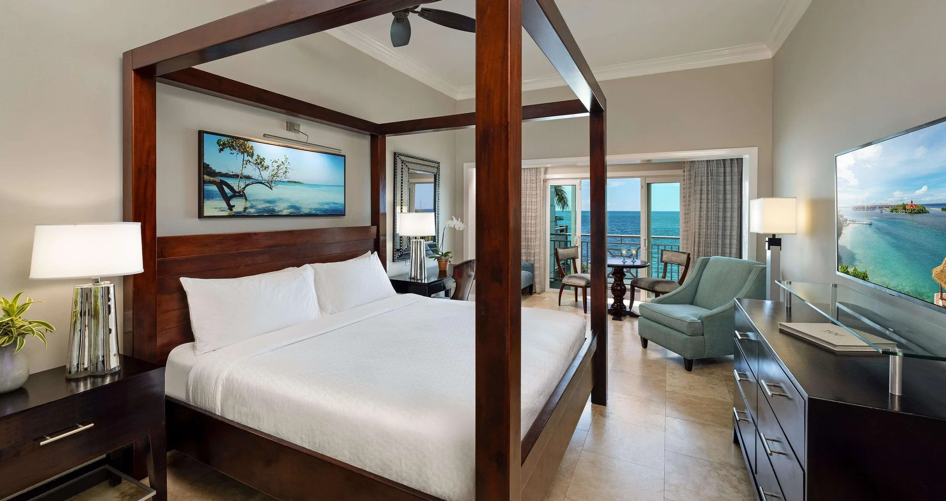 Paradise Beachfront Grande Luxe Club Level Room with four-poster king bed at Sandals Negril.