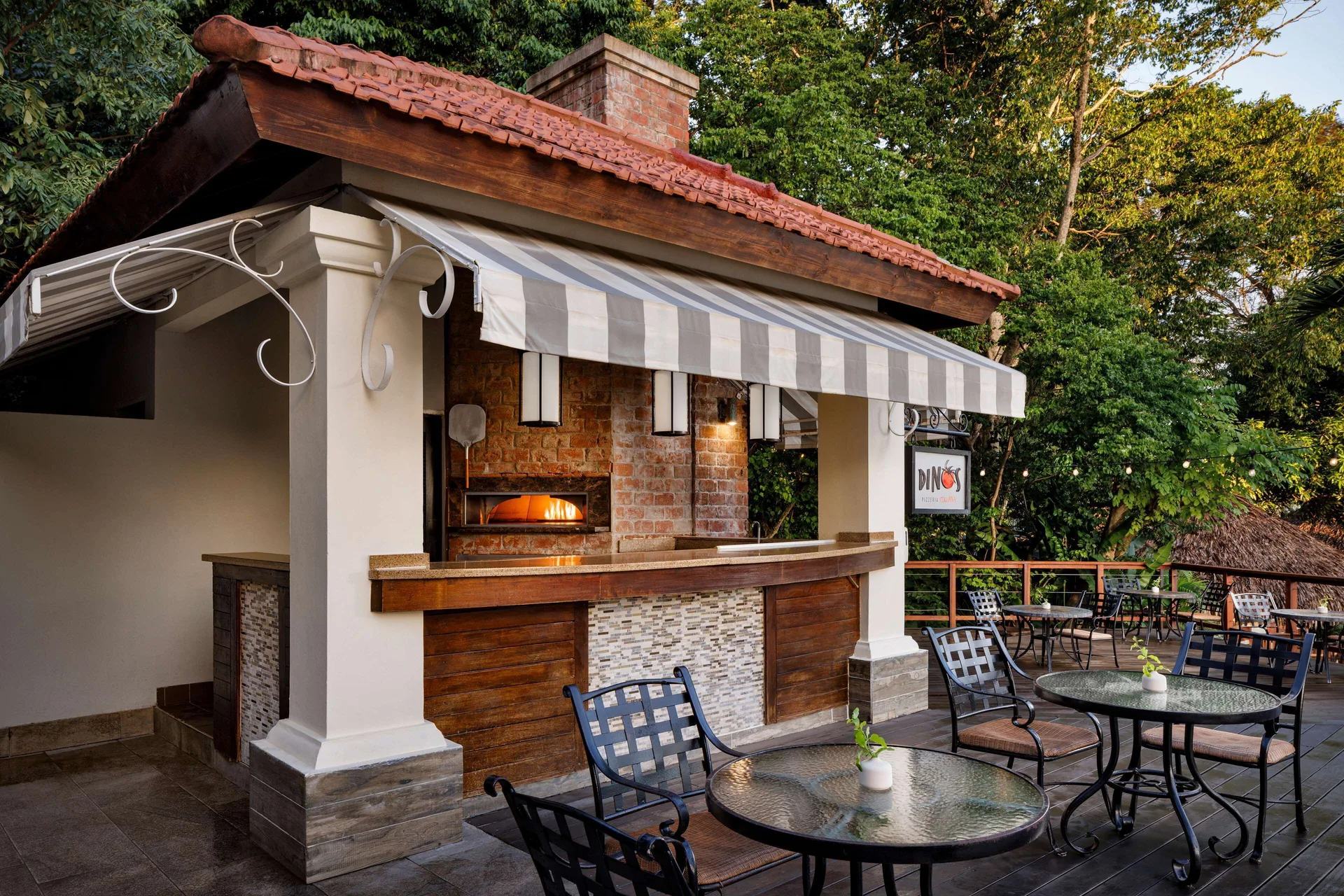 Bella Napoli outdoor pizza counter and patio tables at Sandals Ochi.