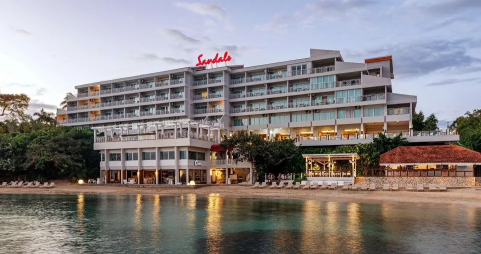 Beachfront Riviera building and calm water at Sandals Ochi.