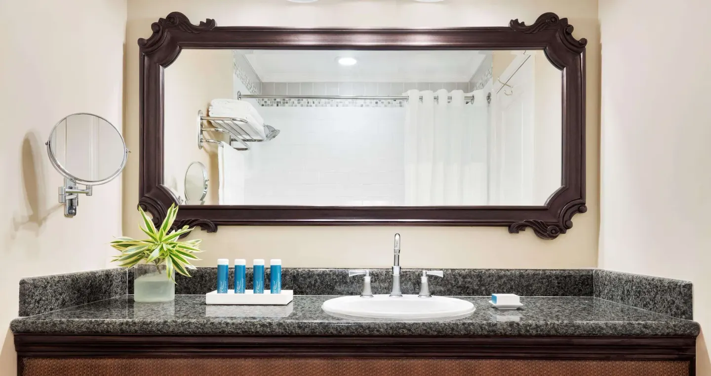 Luxury Room bathroom vanity with large mirror at Sandals Ochi.