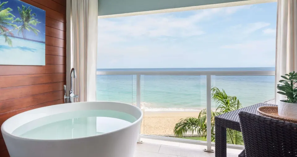 Ocean-view balcony soaking tub in a club suite at Sandals Regency La Toc.
