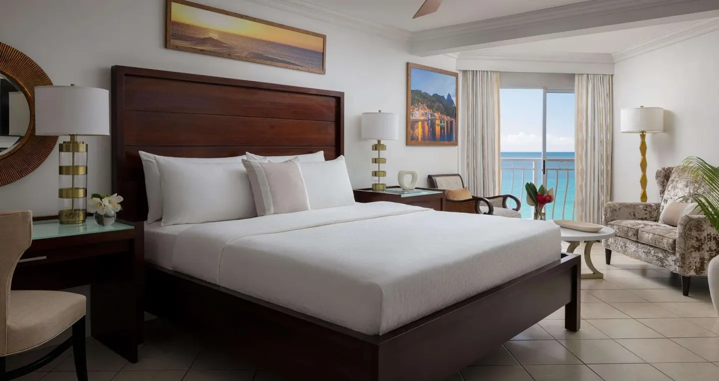 Ocean-view honeymoon room with king bed at Sandals Regency La Toc.