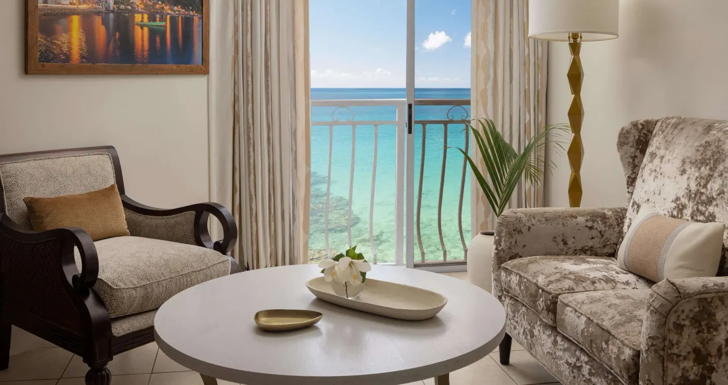 Ocean-view sitting area in a honeymoon room at Sandals Regency La Toc.
