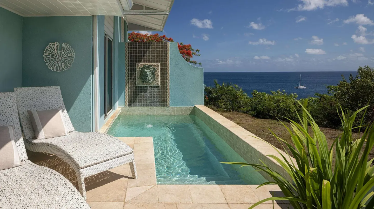 Private plunge pool terrace with ocean view at Sandals Regency La Toc.
