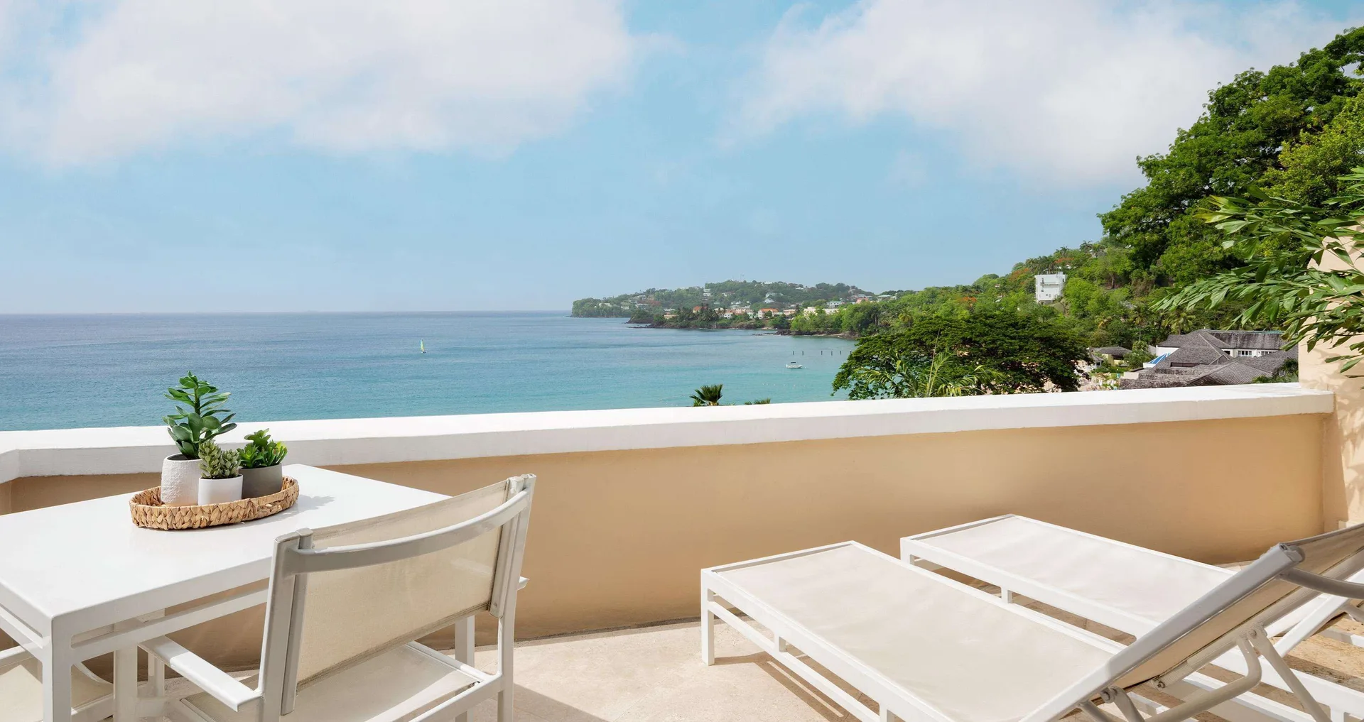 Private sundeck with loungers and ocean view at Sandals Regency La Toc.