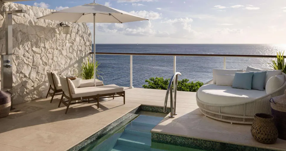 Private plunge pool terrace facing the ocean at Sandals Regency La Toc.