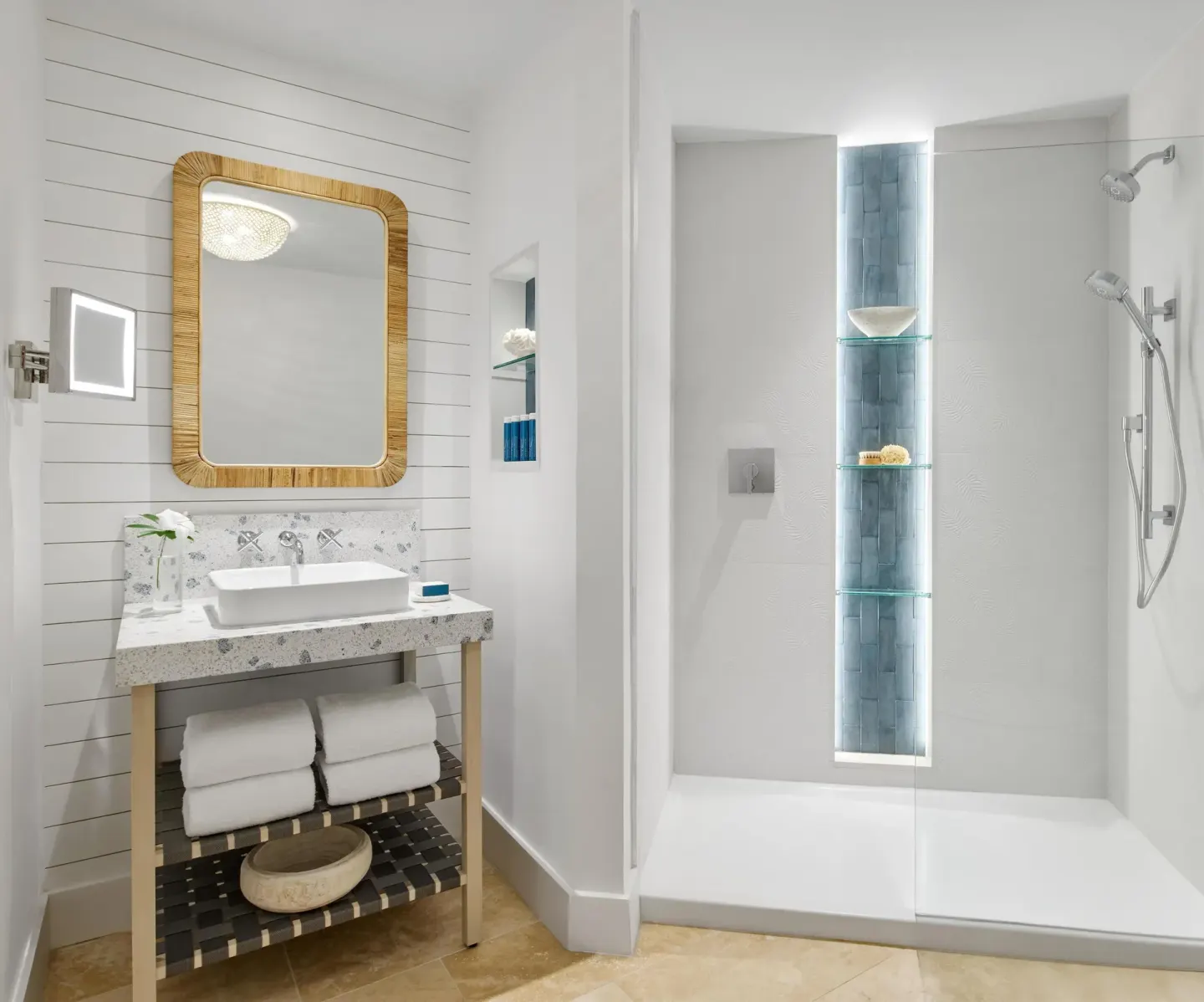 Guest bathroom vanity and white walk-in shower at Sandals Royal Bahamian.