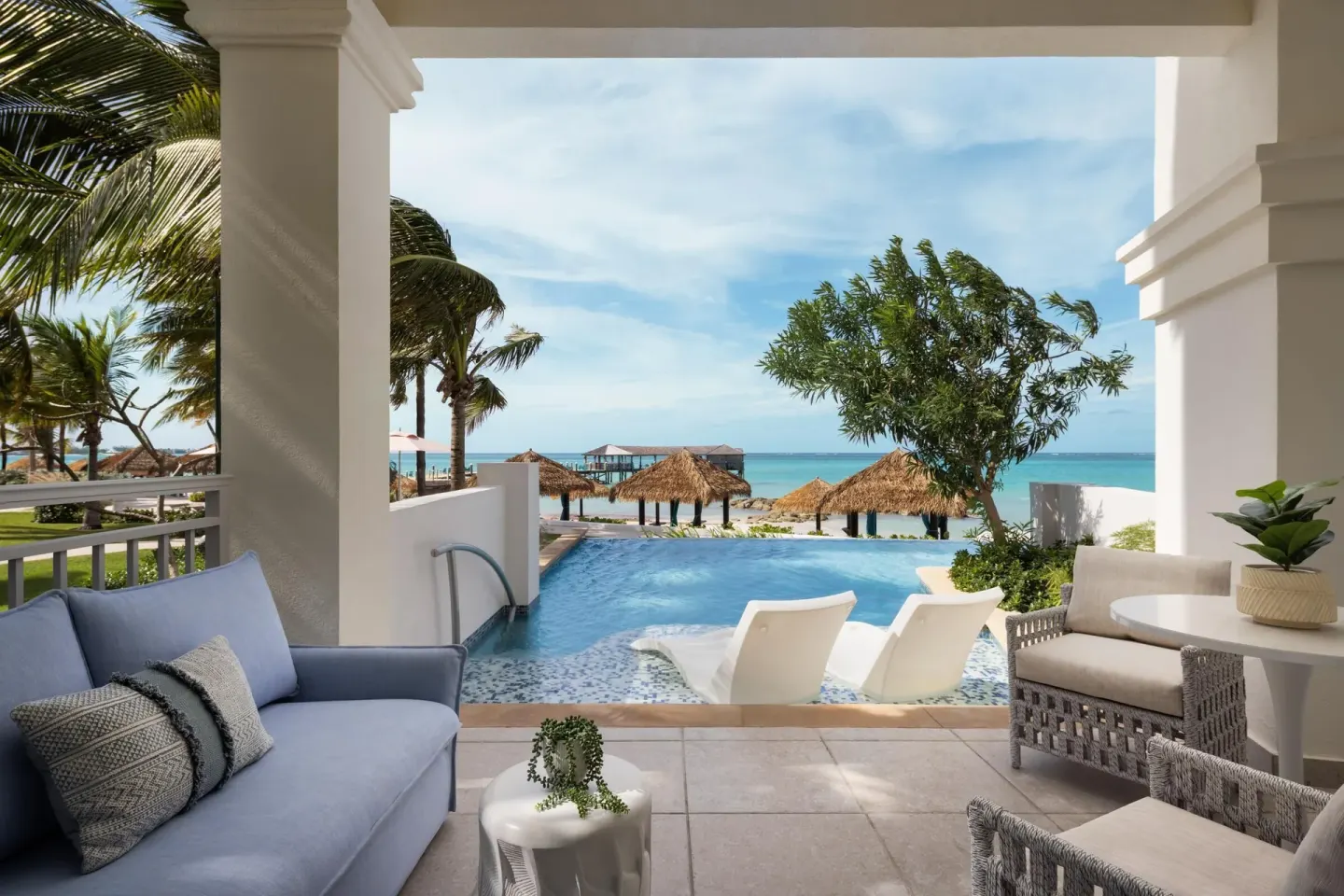East Bay Beachfront Swim-up Butler Suite terrace with ocean view at Sandals Royal Bahamian.