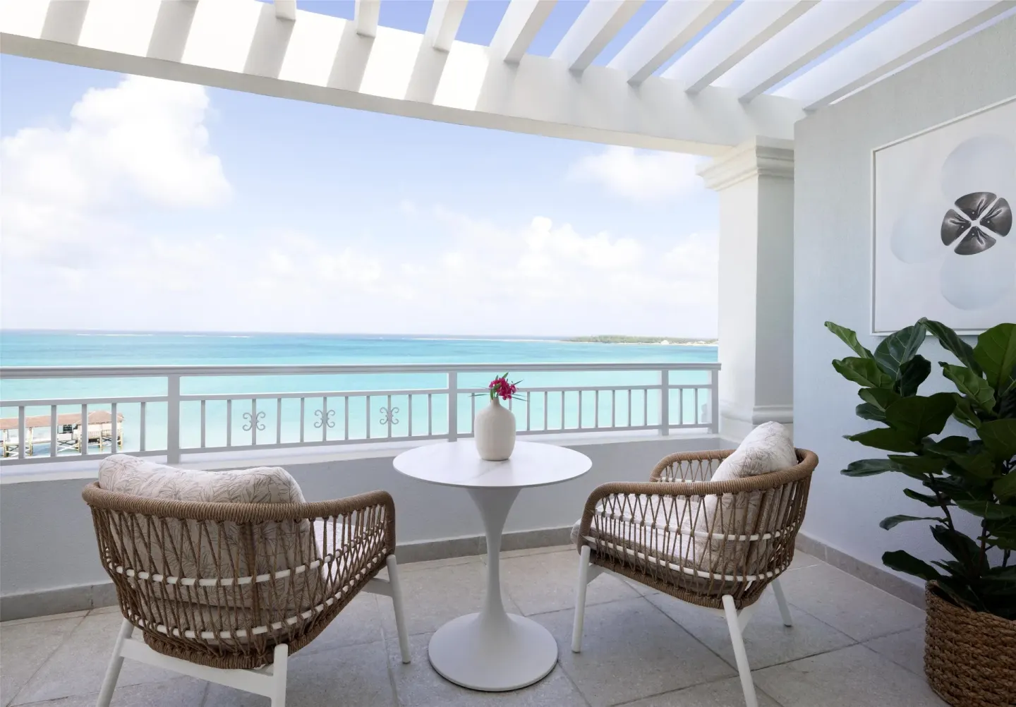 Ocean-view balcony of the East Bay Honeymoon Beachfront Butler Suite at Sandals Royal Bahamian.