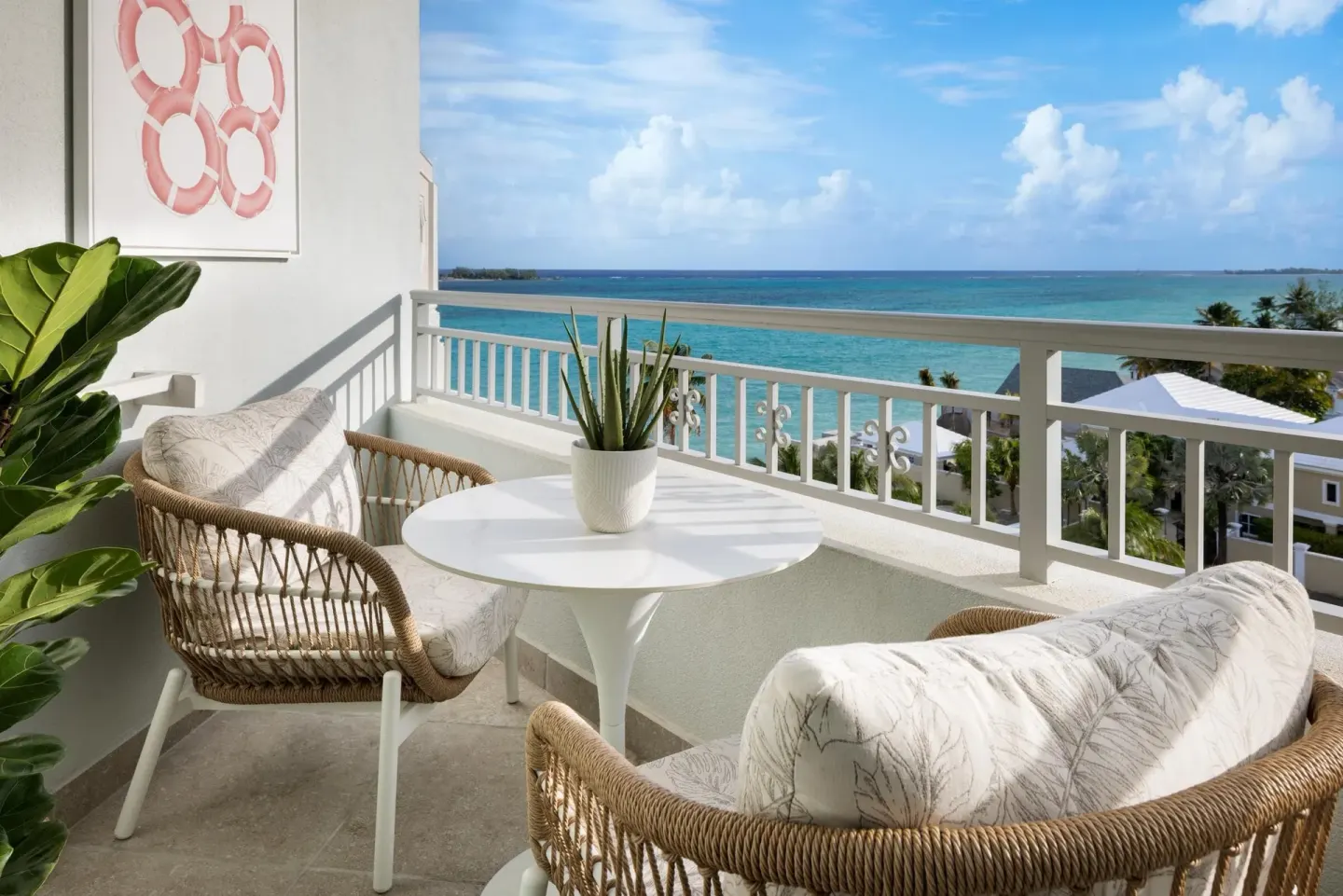 East Bay Oceanview Grande Luxe balcony seating and ocean view at Sandals Royal Bahamian.