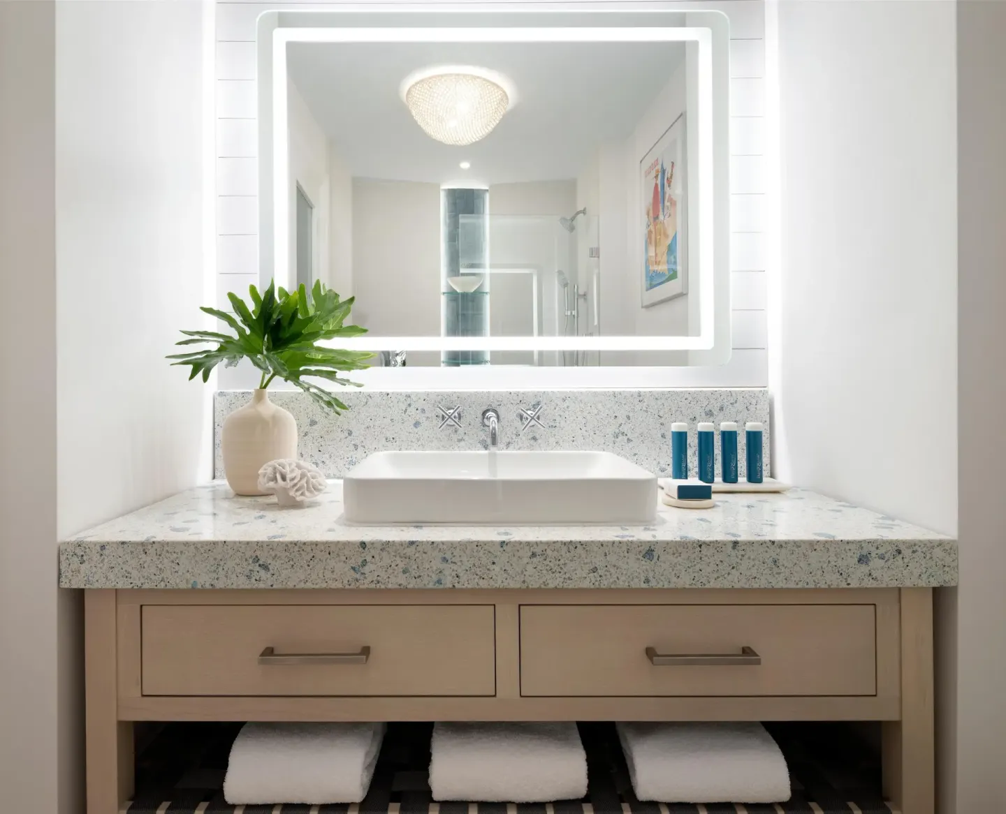 East Bay Oceanview Premium bathroom vanity with lit mirror at Sandals Royal Bahamian.