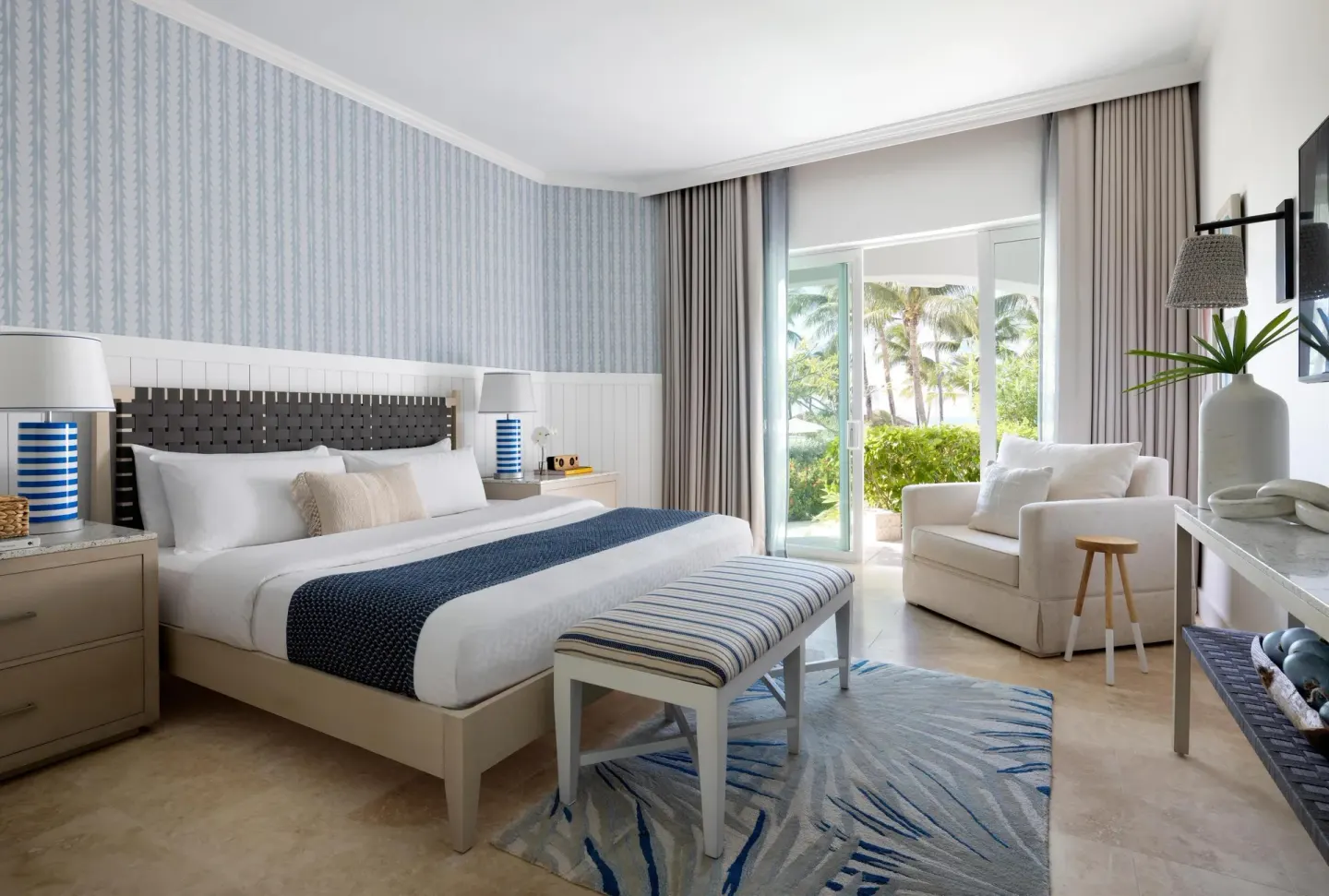 East Bay Poolside Walkout Club Level Room with king bed at Sandals Royal Bahamian.