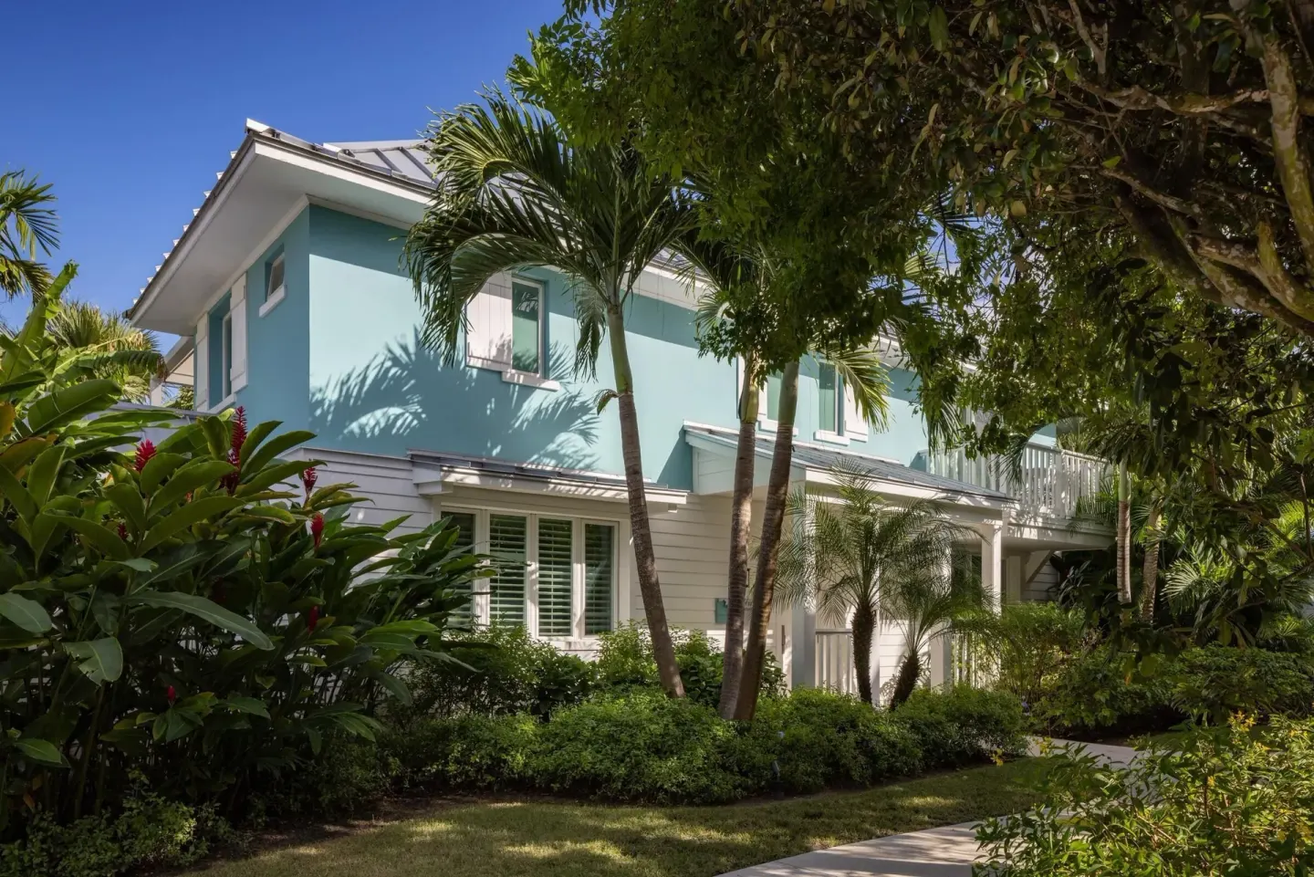 Island Village villa exterior among tropical landscaping at Sandals Royal Bahamian.