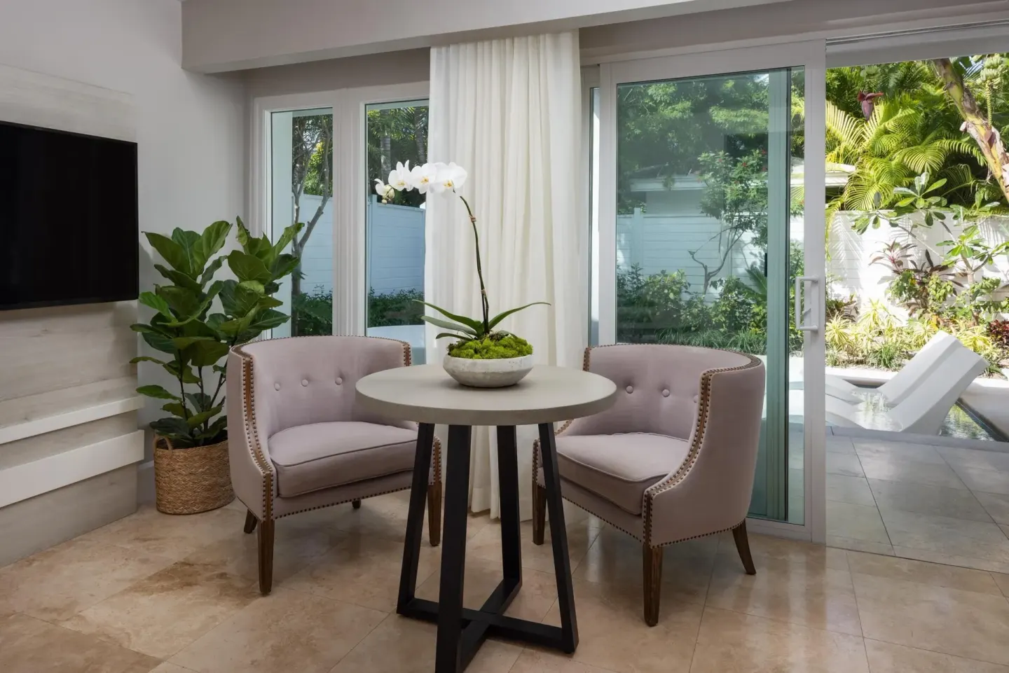 Villa sitting area with patio and private pool at Sandals Royal Bahamian.