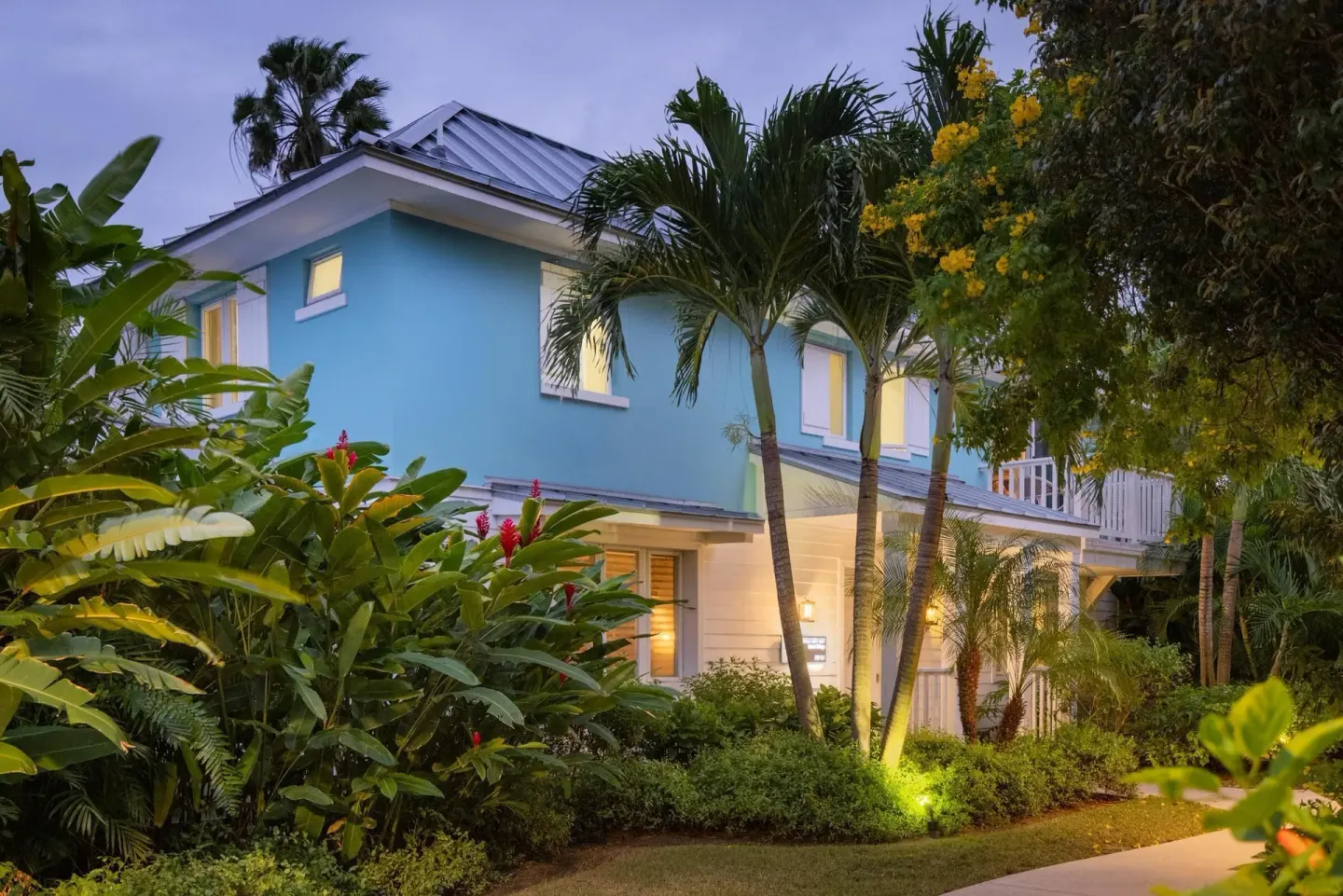 Island Village villa exterior amid tropical landscaping at Sandals Royal Bahamian.