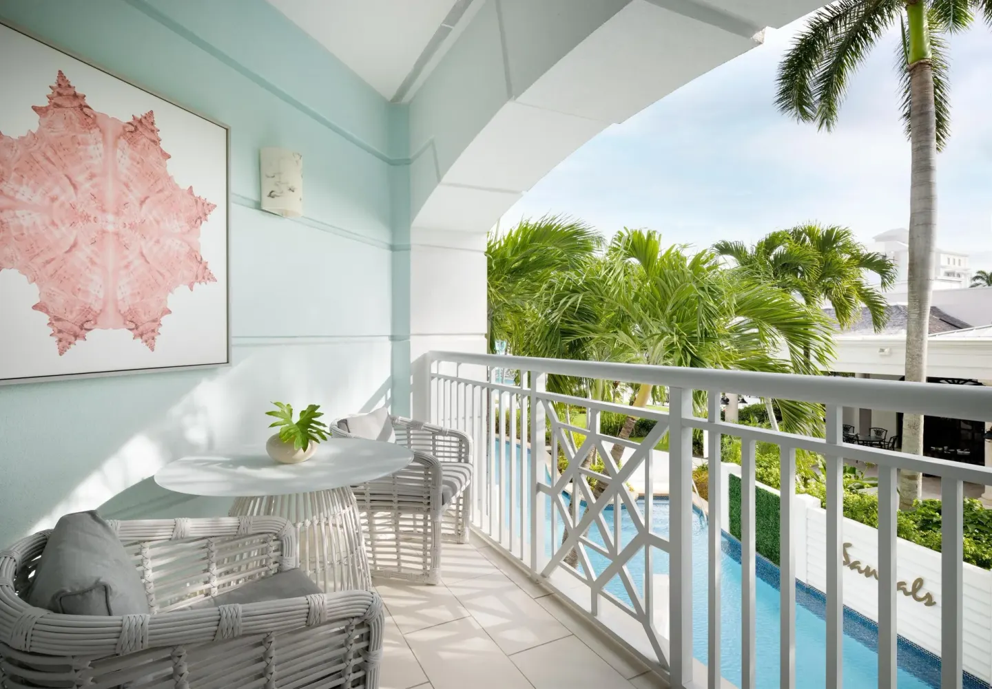 Furnished balcony of a West Bay Honeymoon Junior Suite at Sandals Royal Bahamian.
