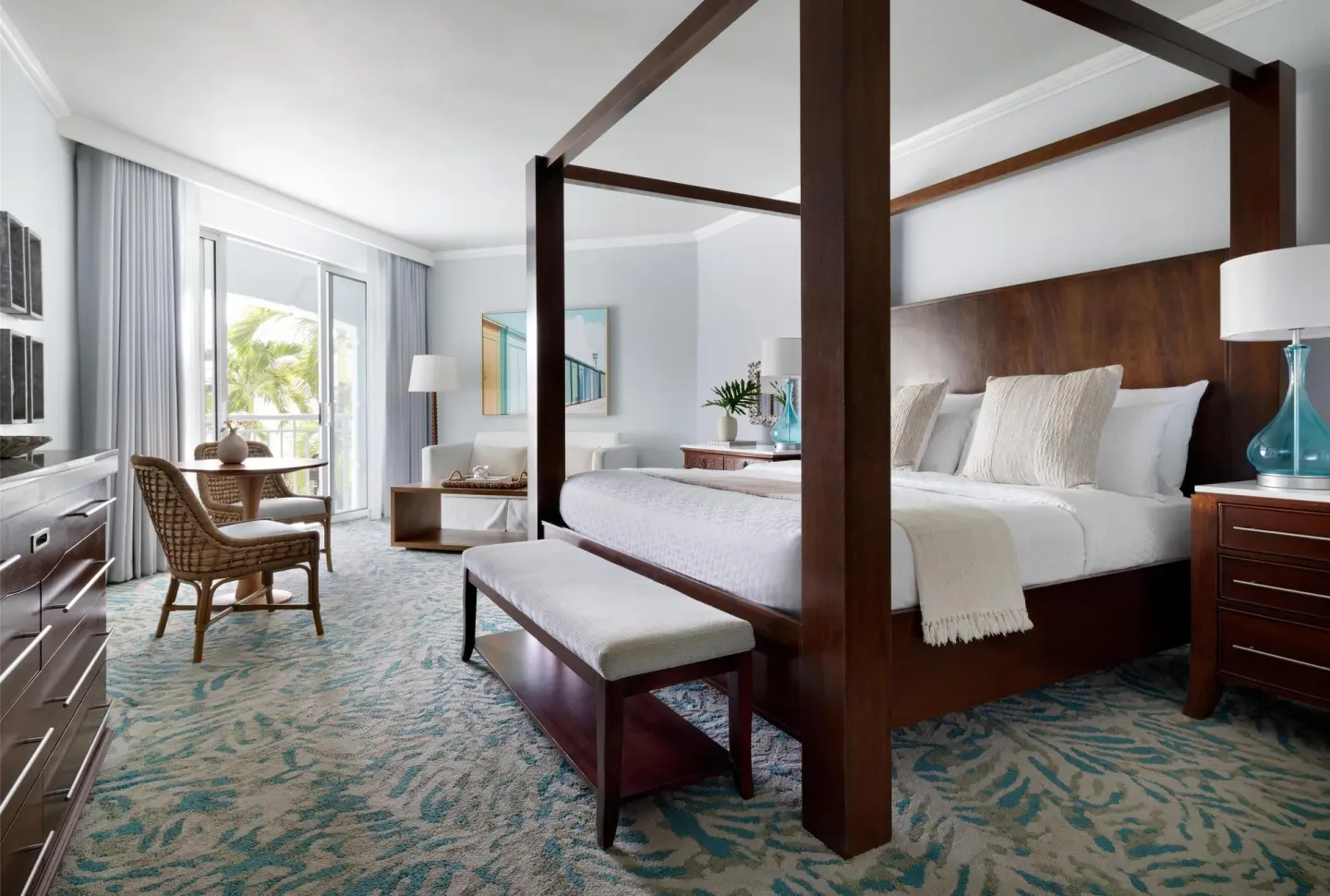Four-poster king bed in a West Bay Honeymoon Junior Suite at Sandals Royal Bahamian.