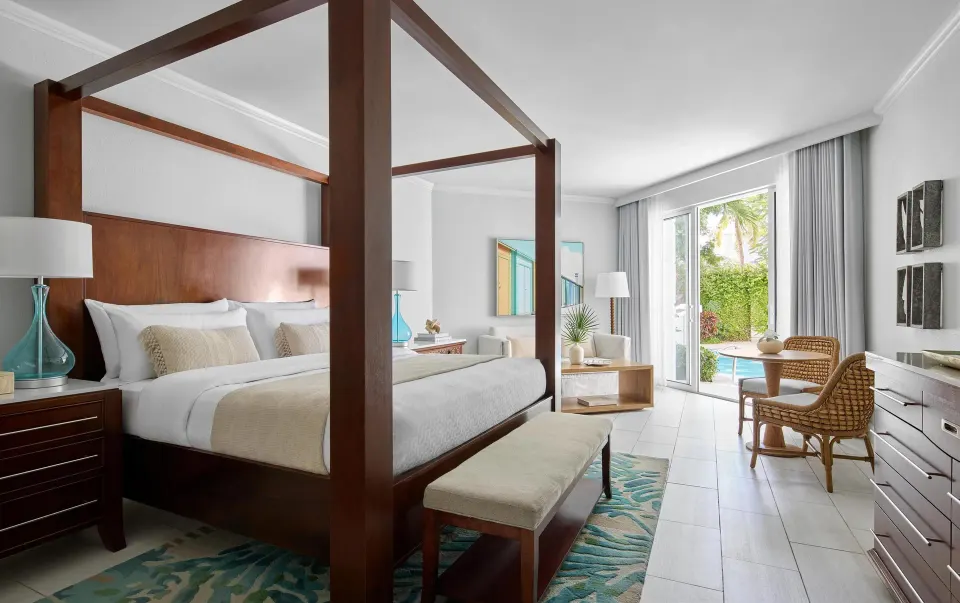 Four-poster king bed in a swim-up suite at Sandals Royal Bahamian.