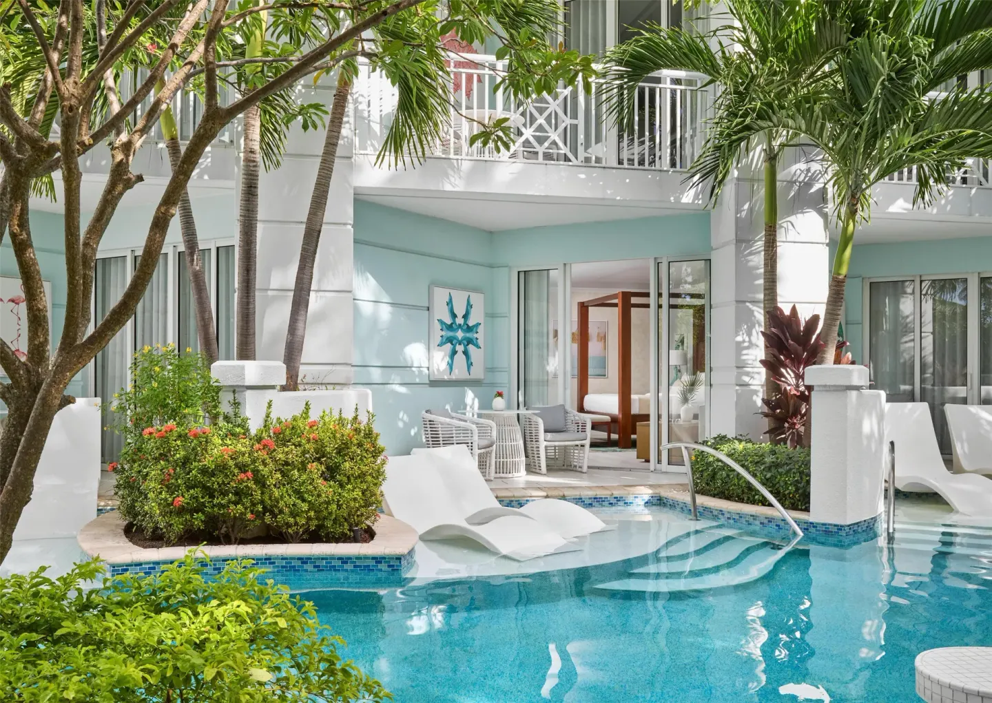 Swim-up patio and lagoon pool outside a suite at Sandals Royal Bahamian.