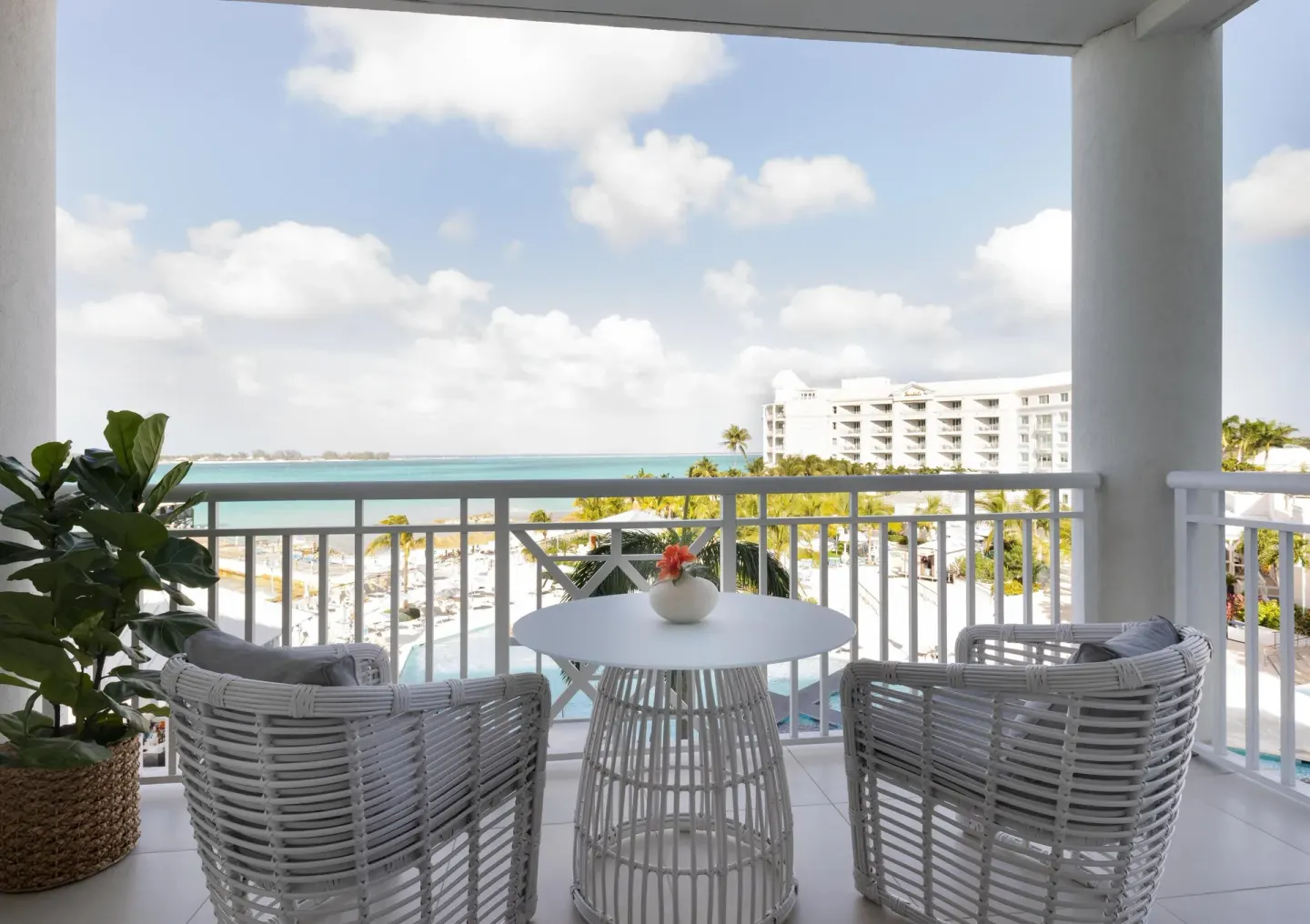 Balcony seating with ocean view for West Bay Honeymoon Suite at Sandals Royal Bahamian.