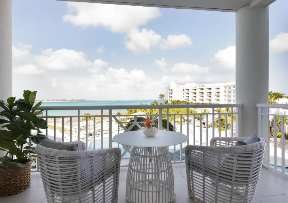 Balcony seating with ocean view for West Bay Honeymoon Suite at Sandals Royal Bahamian.