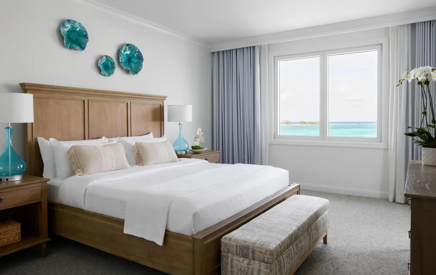 King bedroom with ocean view in West Bay Honeymoon Suite at Sandals Royal Bahamian.