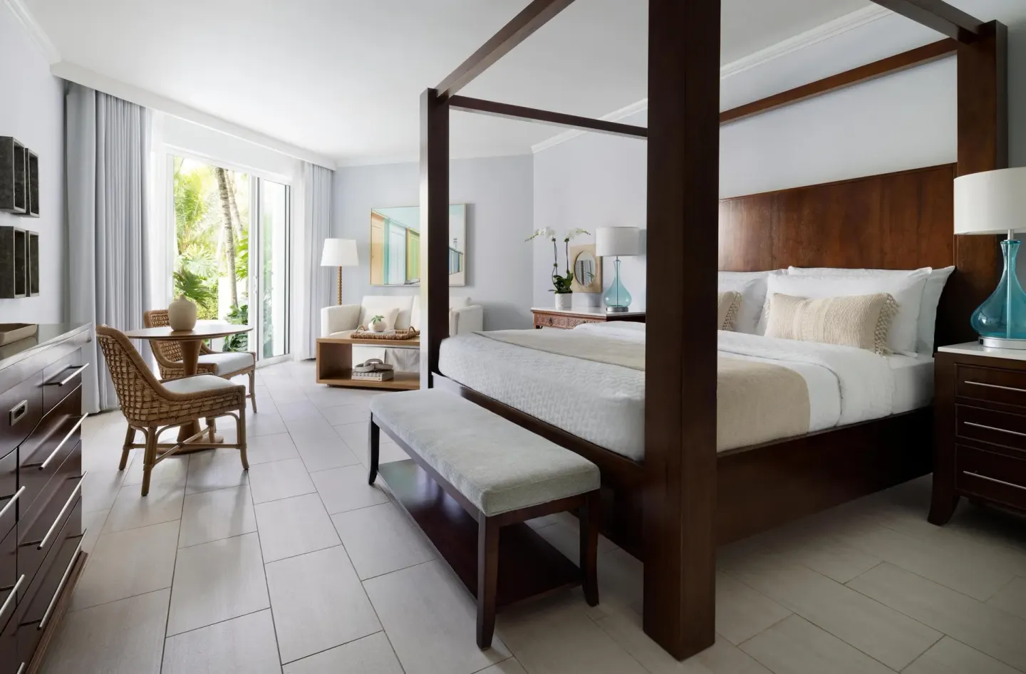 West Bay swim-up junior suite with king four-poster bed at Sandals Royal Bahamian.
