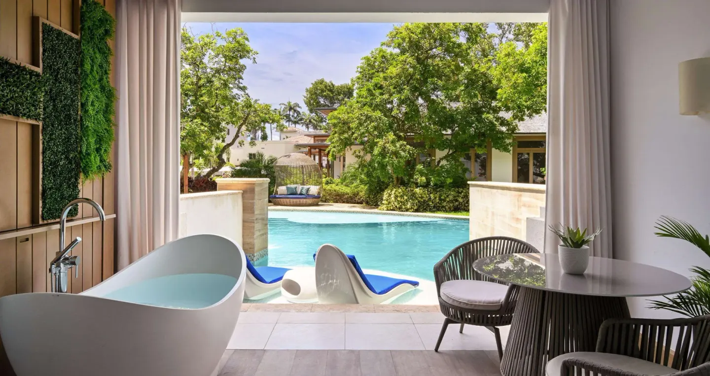 Covered swim-up patio facing a garden pool at Sandals Royal Barbados.