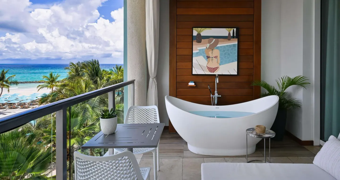 Balcony soaking tub overlooking the beach at Sandals Royal Barbados.