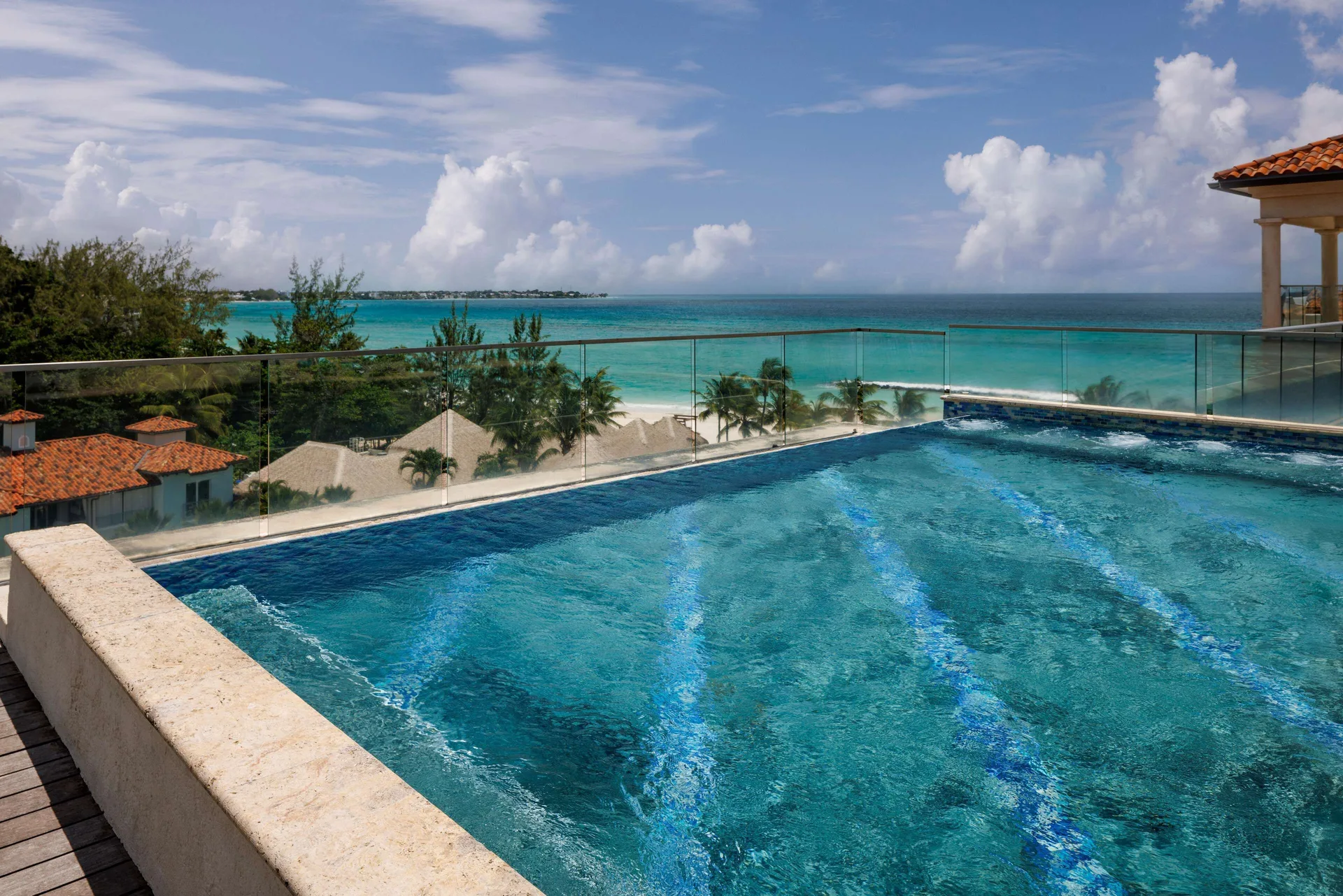 Rooftop infinity pool overlooking the beach and ocean at Sandals Royal Barbados.