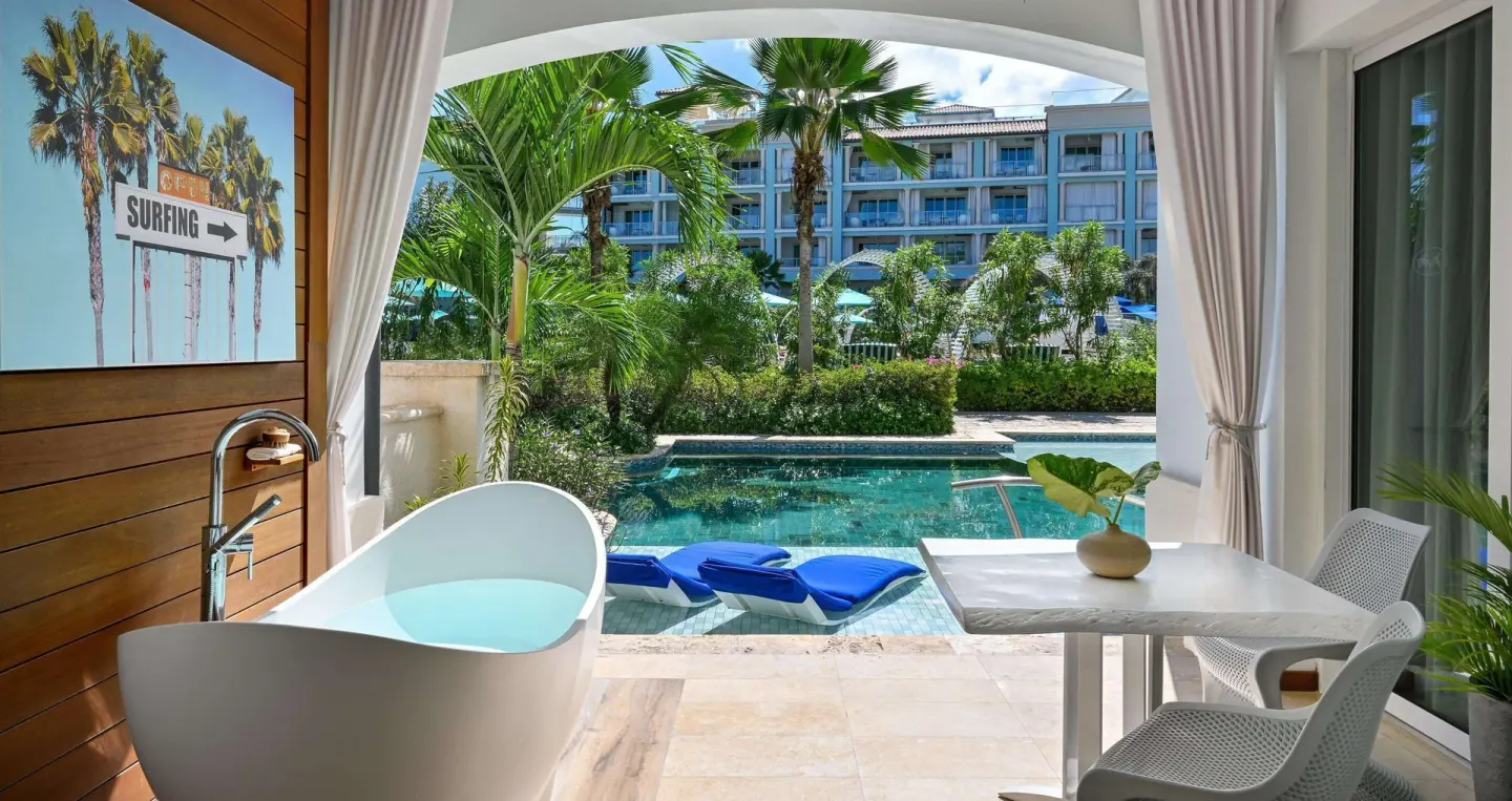 Patio soaking tub and swim-up pool at Sandals Royal Barbados.