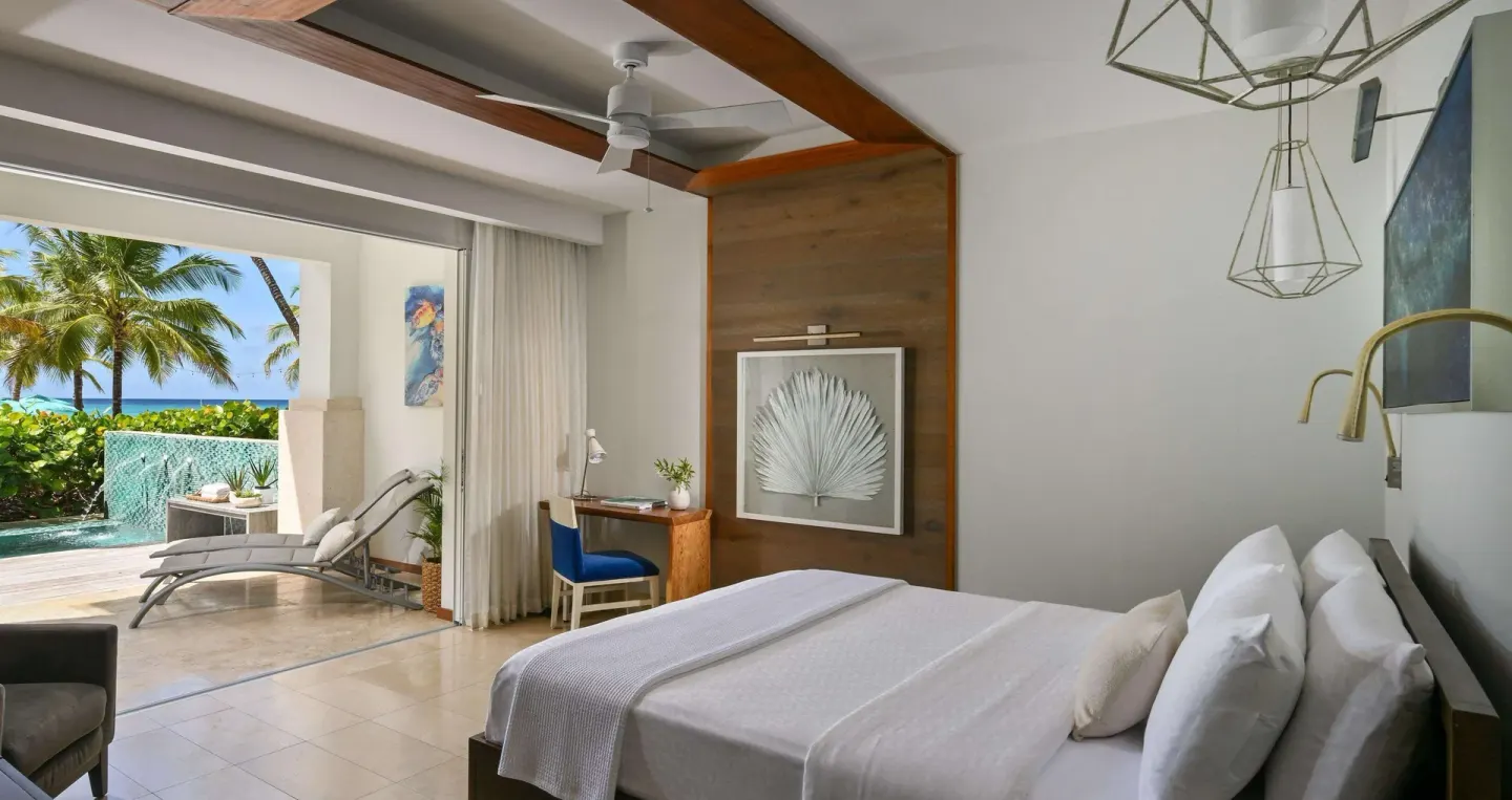 King bed suite opening to a swim-up patio at Sandals Royal Barbados.