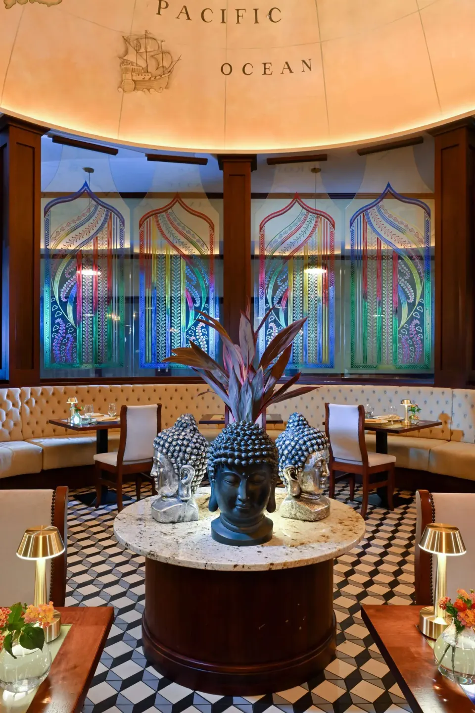 American Tavern dining area with sculptural centerpiece at Sandals Royal Barbados.
