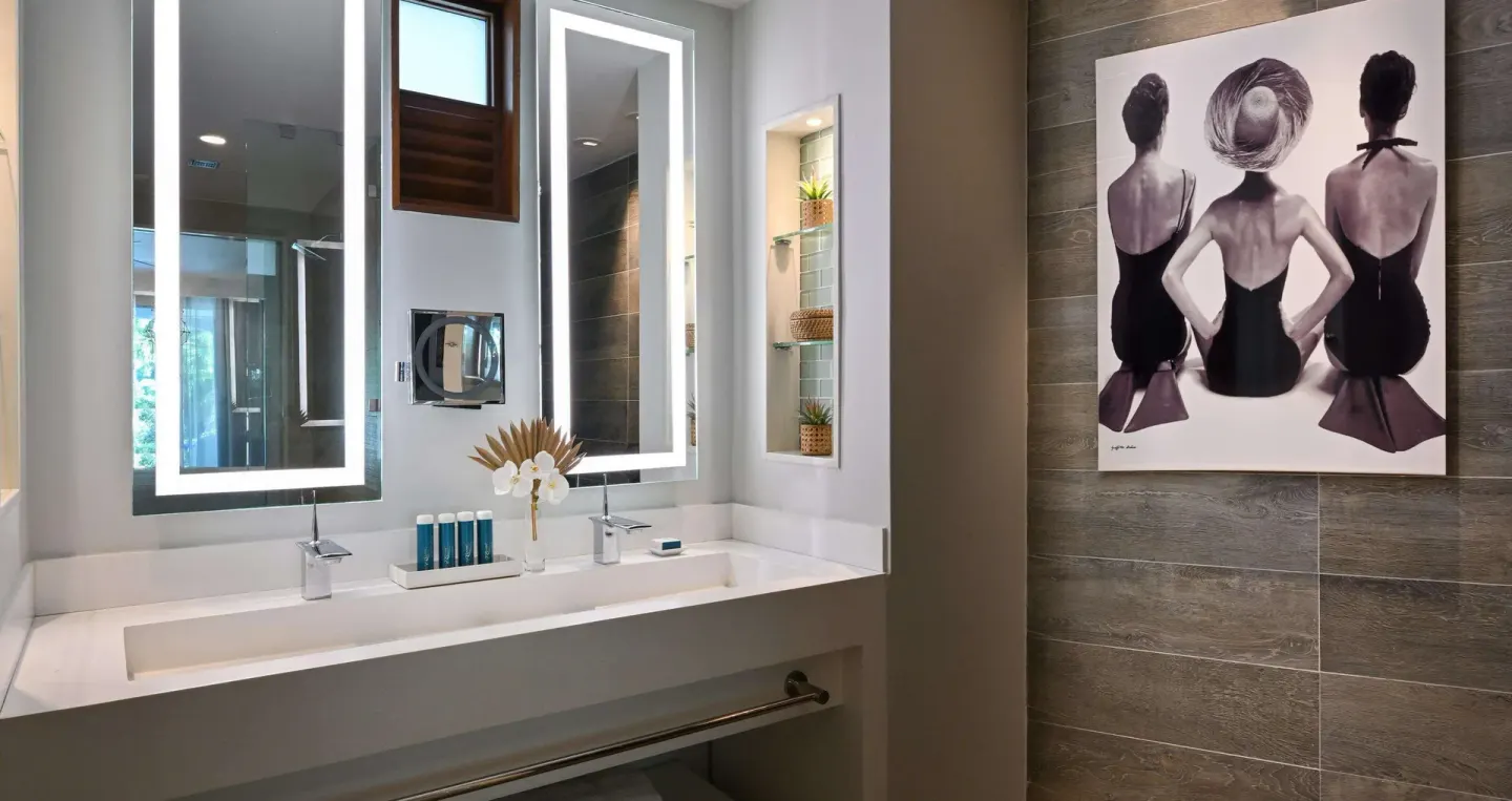 Club suite bathroom vanity with lit mirrors at Sandals Royal Barbados.