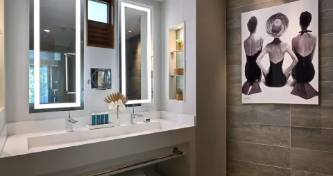 Club suite bathroom vanity with lit mirrors at Sandals Royal Barbados.
