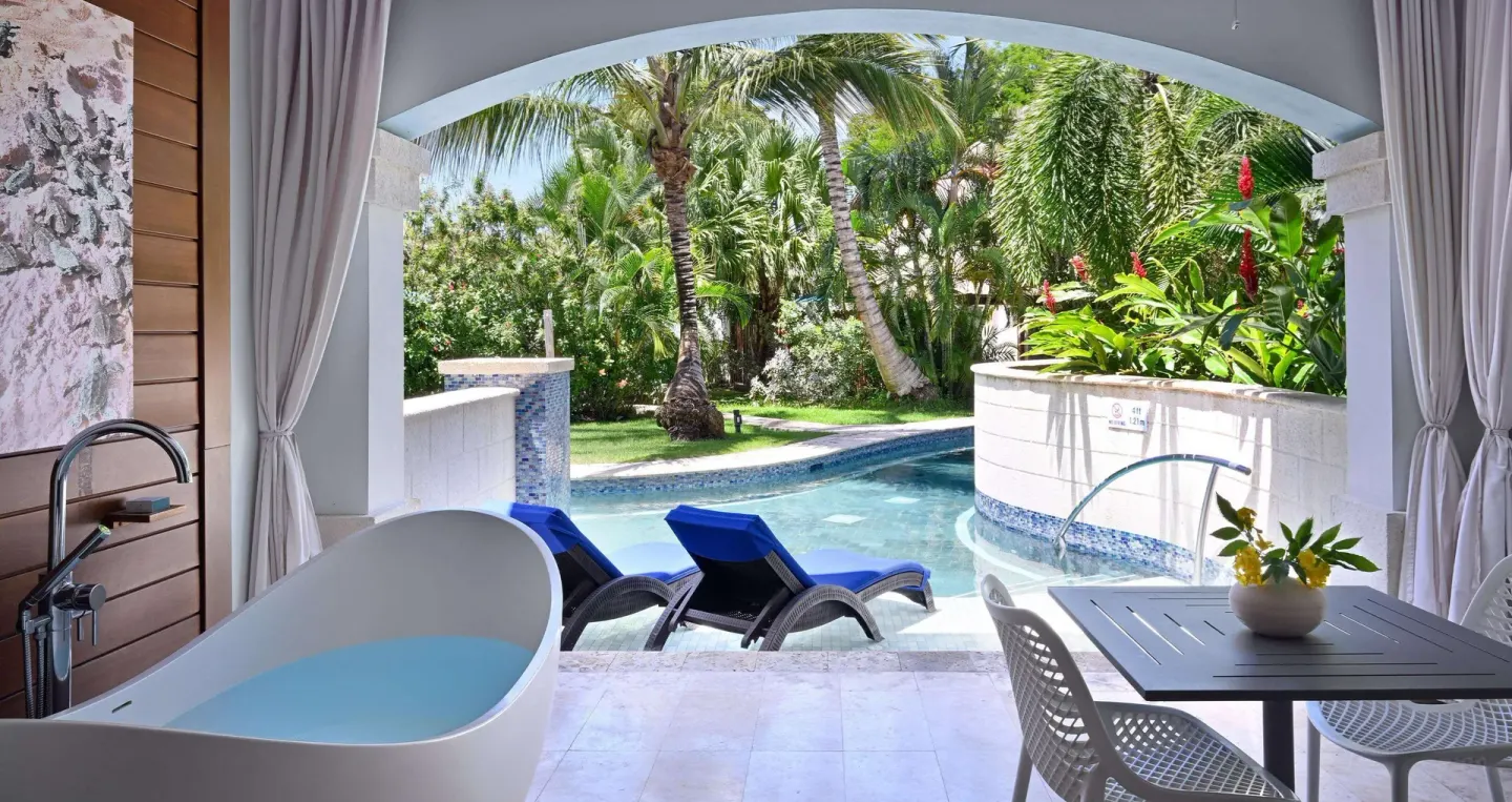 Club Suite swim-up patio with soaking tub and pool at Sandals Royal Barbados.