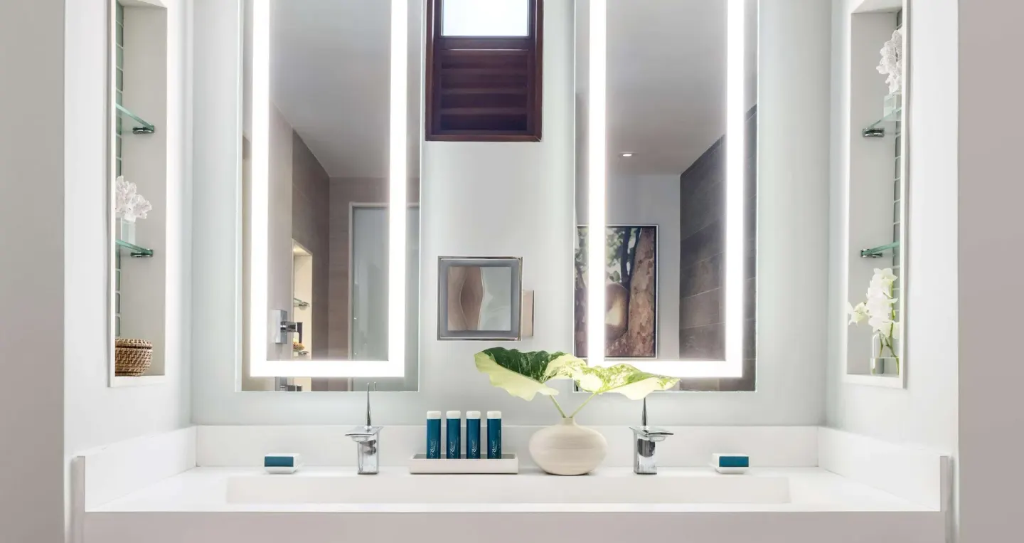 Royal Suite double vanity with illuminated mirrors at Sandals Royal Barbados.