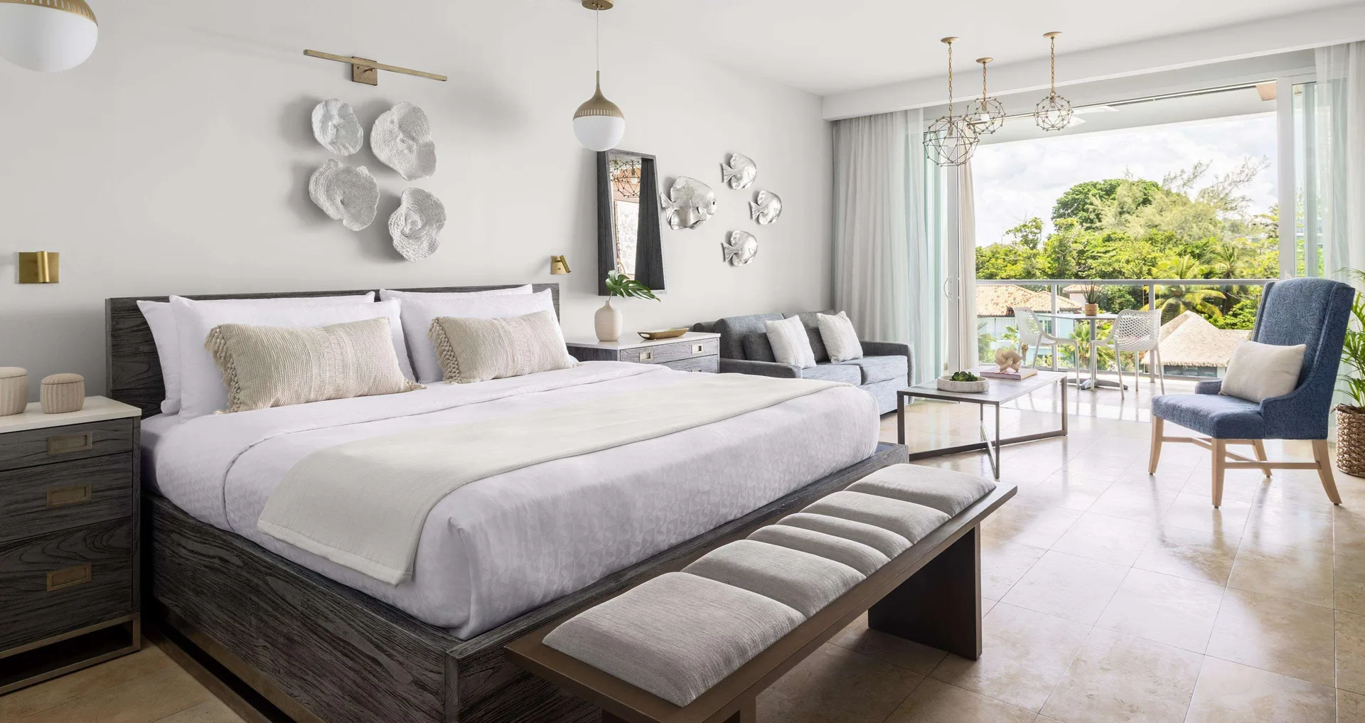 Royal Suite king bed and balcony seating at Sandals Royal Barbados.