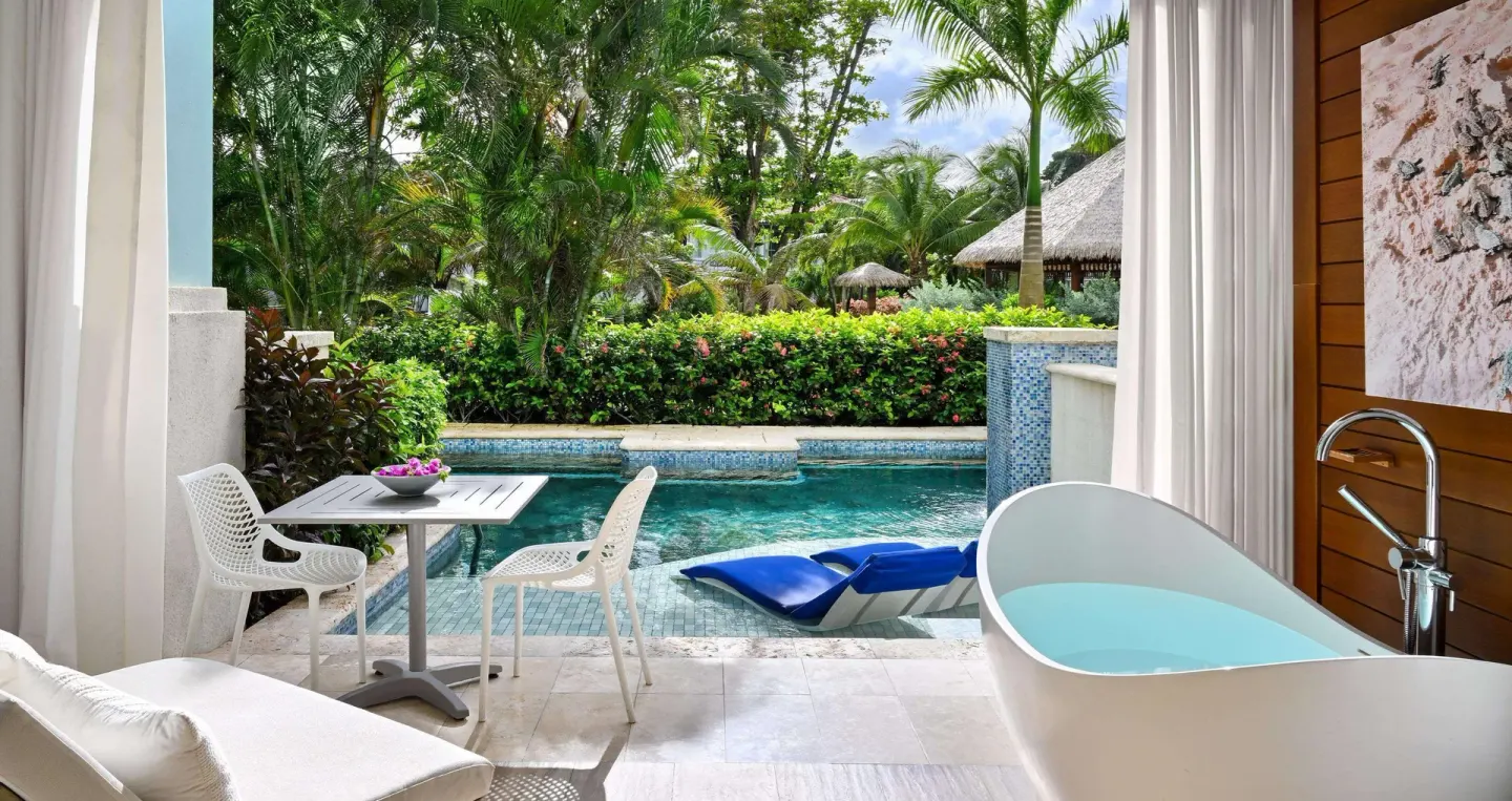 Royal Seaside Swim-up patio with soaking tub and pool at Sandals Royal Barbados.